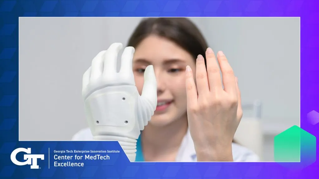 human hand next to robotic hand