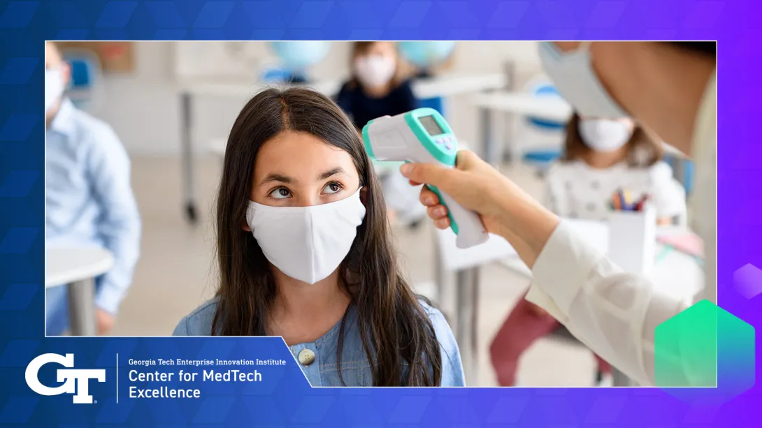 Doctor checking childs temperature