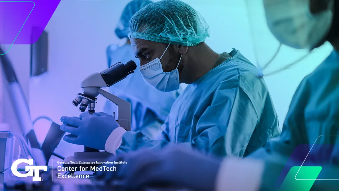 doctor looking into microscope